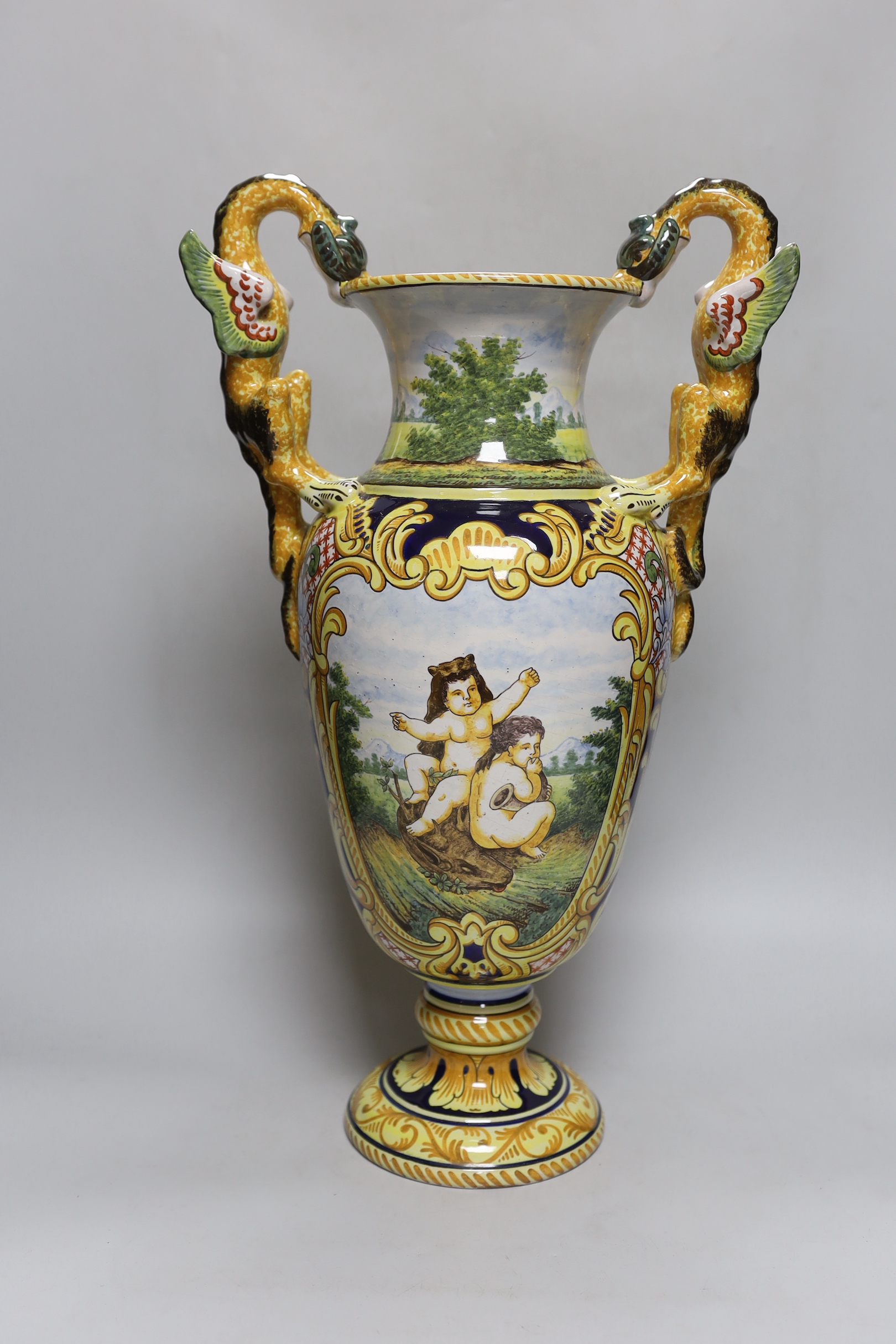 A Nevers faience two handled vase, signed A. Montagnon, 52cm high